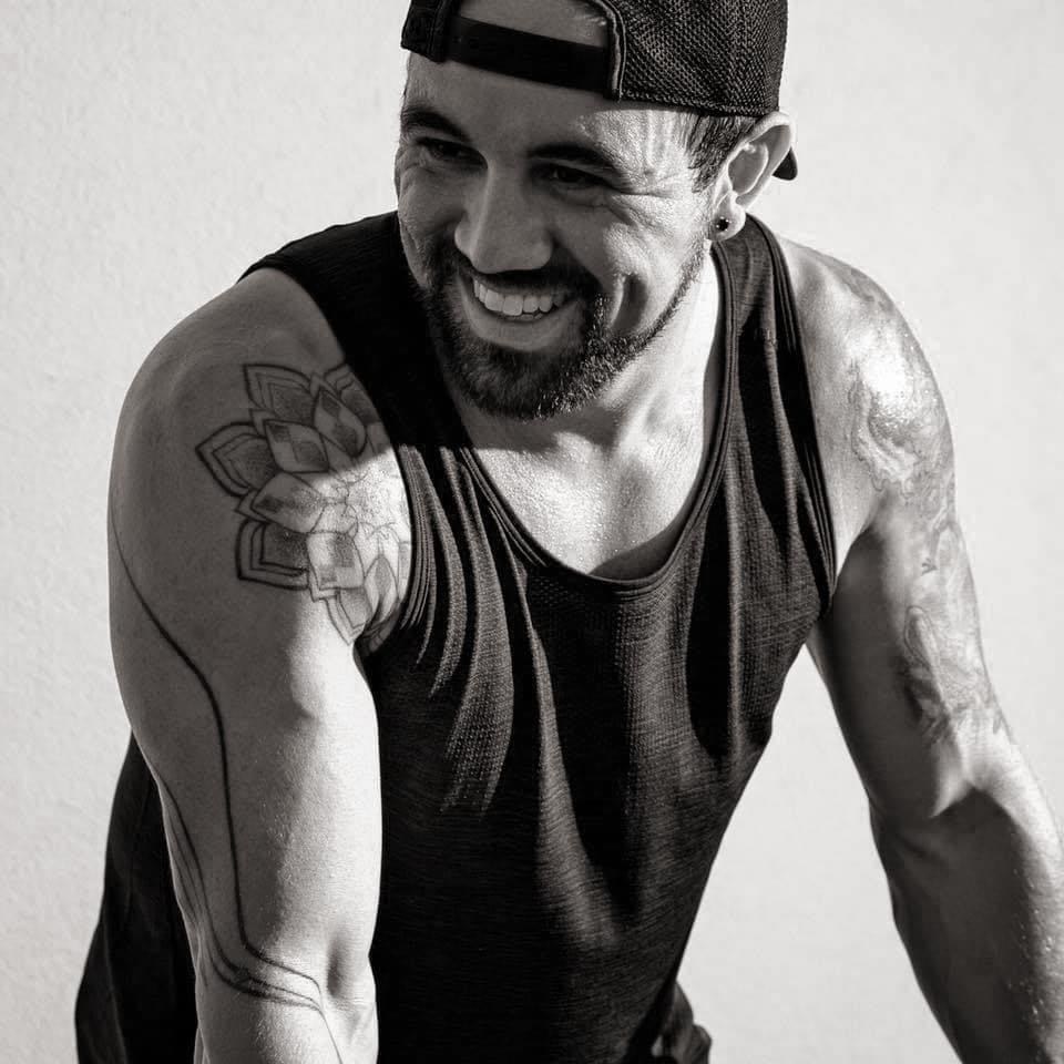 Aaron smiling in a training portrait